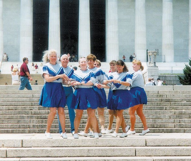 Members of Capitol City cloggers perform in front if the Lincoln Memorial in Washington D.C.