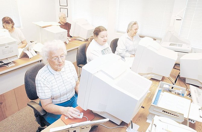 Left to right Laura-Lee Wetzel, Mary McFarland, Doris Knapp are learning how to use the computer through the SeniorNet Computer Learning Program Friday morning. The class is designed to teach seniors the basic uses of a computer. All instructors and coaches for the program are volunteers.