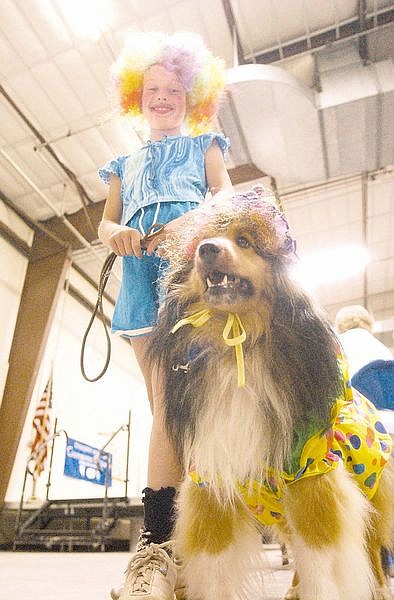 Jacki Dunt, 9, and her dog, Laddy, came to the Pets and Projects Parade as clowns. Photo by Brian Corley