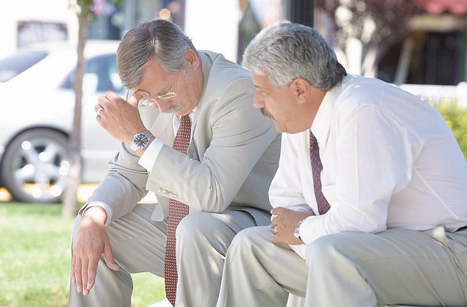 Insurance industry lobbyist Jim Wadhams, left, talks with lawyers&#039; lobbyist Billy Vassiliadis on the front steps of the Legislature in Carson City, Nev., Tuesday, July 30, 2002.  They play key roles in the negotiations on a plan to help lower doctors&#039; malpractice insurance rates. The plan is being debated at a special Nevada legislative session. (AP Photo/Nevada Appeal, Cathleen Allison)