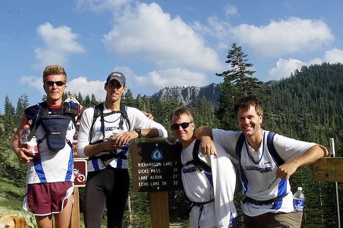 Nevada newsmen, from left, Karl Horeis, Rick Gunn, Jeremy Evans and K.M. Cannon pose at the end of a 13-hour, 32-mile hike from Echo Lake to Barker Pass on the Tahoe Rim Trail Monday, Aug. 5, 2002. The hike was the first day of a 10-day adventure featuring the top 10 challenges in the State of Nevada listed by the Commission on Tourism. Photo by Izzy Luna