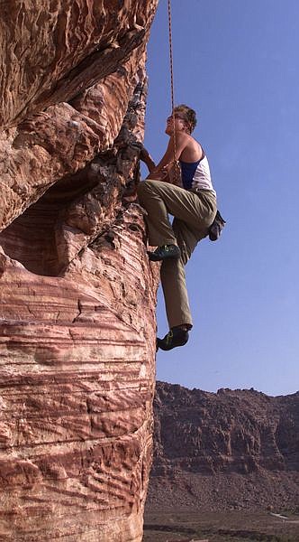 Nevada Appeal 10-in-10 team member Karl Horeis climbs on Cannibal Crag in Red Rock Canyon National Conservation Area near Las Vegas Tuesday, Aug. 13, 2002, to complete Challenge #8. Photo by K.M. Cannon
