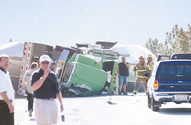 A Semi-truck with two attached tanks overturned blocking  the East bound lane Thursday morning on Spooner Summit.