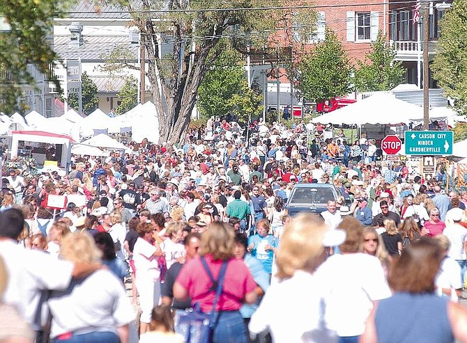 Photo by Brian Corley.Thousands of shoppers flooded Genoa on Saturday for the 82nd Candy Dance Arts and Crafts Faire. The fair is also open today.