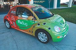 A late model Volkswagen has been transformed into the FluBug  on East King Street Wednesday morning reminding people of the vaccinations that were taking place inside.  photo by Rick Gunn