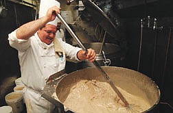 Nugget cook Marino Banuelos stirs up one giant batch of turkey gravy at the Nugget Thursday morning.