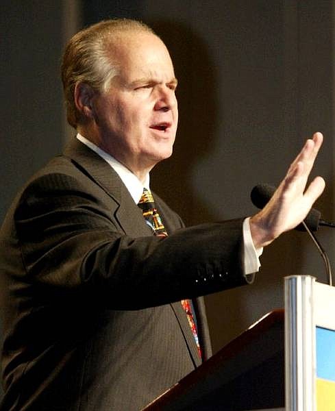 Conservative commentator Rush Limbaugh gestures while speaking during the National Association of Broadcasters convention Thursday, Oct. 2, 2003 in Philadelphia. Limbaugh said Thursday he resigned as an ESPN sports analyst to protect network employees from the uproar over critical comments he recently made about Philadelphia Eagles quarterback Donovan McNabb. (AP Photo/Joseph Kaczmarek)