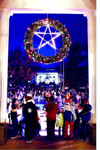 BRAD HORN/Nevada Appeal Residents join together to celebrate the annual tree lighting at the Capital Thursday evening.
