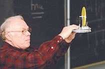WNCC&#039;s Ron Newton explains the wonders of thermal dynamics with a device that opposes heat and cold to make a small wheel turn.  Newton and others from the WNCC science dept spoke to a group of high school students about the &#039;magic&#039; of science and engineering.