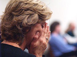 Cathy Atchian, sister of Rick Albrecht, cries after the sentence was imposed on Tony Echols Thursday afternoon. Photo by Brian Corley