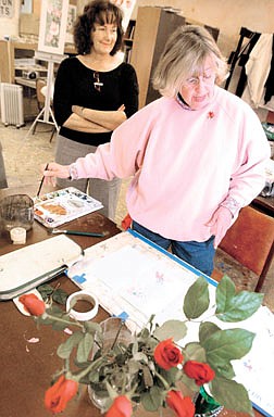 Ginger Rose goes over the finer points of watercolor and roses at the Brewery Arts Center Friday afternoon.  She was instructing  her class on painting roses for Valentines Day.  photo  by Rick Gunn