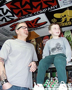 Eric Robie, owner of Out of Bounds, with his son Jacob, 7, is leading an effort to build a new skatepark in Carson. Robie plans to ask the Parks and Recreation Commission tonight for approval to build the park at Centennial Park.