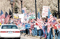 A huge crowd rallied the troops Saturday in front of the Legislative building Saturday. People waved flags, held pictures of loved ones in the military and were honked at by cars passing by.  photo by Rick Gunn