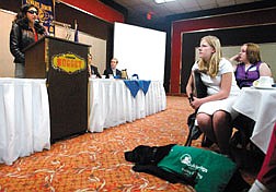 Aerial Gilbert, left, speaks to the Kiwanis Club of Carson City on Thursday afternoon at the Nugget.  Gilbert, who lost her sight in 1988, is now the director of volunteers for Guide Dogs for the Blind, Inc., in San Rafael, Ca.  Sarah Zittel, center, and Sierra Dean, both 13, and Sarah&#039;s dog Datan participate in the Guide Dogs for the Blind Puppies in Training program.