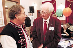 Carson City Icon Bill Dolan, right, gets kudos and birthday greetings from Nevada State Archivist Guy Rocha during a celebration of his birthday at the BAC Sunday evening.