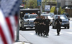 Members of the Carson City Special Operations Response Team run the final leg of a 400-mile journey from Las Vegas carrying a baton which holds the names of Nevada peace officers who died in the line of duty.  Law enforcement from across the state will participate in the Nevada Peace Officers Memorial ceremony today on the Capitol grounds at ????.