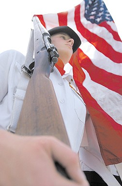 Megan Hanke, 14, presents the colors during the Memorial Day ceremony at the Lone Mountain Cemetery in Carson.