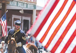 Richard Lee, a member of the Nevada Civil War volunteers, heads down C Street during the 4th of July Parada in Virginia City Saturday afternoon.
