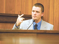 Christopher Fiegehen tells defense attorney Richard Young about how he heard sirens approaching the house during testimony Friday afternoon.