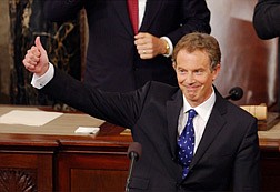 ** RETRANSMITTING FOR ALTERNATE CROP ** British Prime Minister Tony Blair gives a thumbs-up after speaking to a joint session of Congress inside the House chambers of the U.S. Capitol on Thursday, July 17, 2003. (AP Photo/Gerald Herbert)