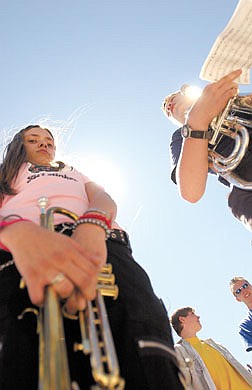 photo by Brad HornHeather Schofield, left, and Neal Keyes, right, listen to instructions at Carson High School during marching band practice.