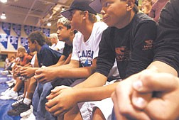 Freshman listen during orientation in the gym at Carson High School Friday morning.