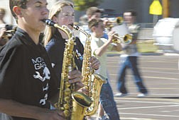 The Carson High School Blue Thunder marching band practices Wednesday afternoon in the south parking lot of the school.   A neighbor is complaining of the noise from their and wants them to change either the time or the location of their rehearsals.