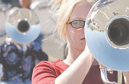 CHS marching band member Jennifer Sturm Plays horn  during marching band practice at CHS Thursday. photo by Ric Gunn