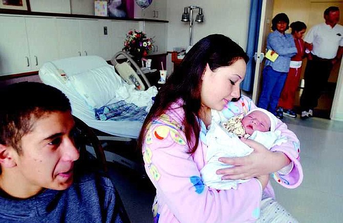 BRAD HORN/Nevada Appeal Caleah Barnwell holds her daughter Anica Castaneda while her family Lupe, Steve, and Sierra look on. The father Jose Castaneda is pictured sitting.