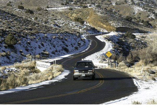 A Storey County Commissioner has proposed making Six Mile Canyon Road, a section of which is shown here in this Wednesday, Jan. 7, 2004 photo, into a toll road for non-residents who use it to commute from the Dayton, Nevada area through Virginia City, to Reno.  (AP Photo/Cathleen Allison)