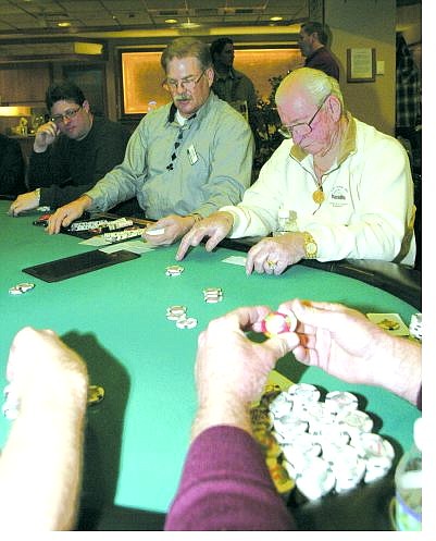Dan Thrift/Tahoe Daily Tribune Mike Giordano, a dealer at Harveys Resort &amp; Casino presides over a game of Texas Hold&#039;em.