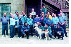 Warden Michael Budge, back row center, receives the first Humanitarian Award from inmates at the Nevada State Prison.  Nevada State Prison photo