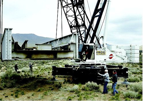 Cathleen Allison/Nevada Appeal Workers move sections of the future V&amp;T Railroad bridge near Mound House on Monday afternoon. The bridge made the 400-mile trip from Las Vegas Friday and Saturday, and will remain in storage until it is ready to be placed over Highway 50.