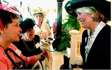 BRAD HORN/Nevada Appeal Nevada&#039;s first lady Deema Guinn admires Sally Walter&#039;s pink hat during the Pink Tea benefit at the Govenor&#039;s Mansion on Saturday afternoon.