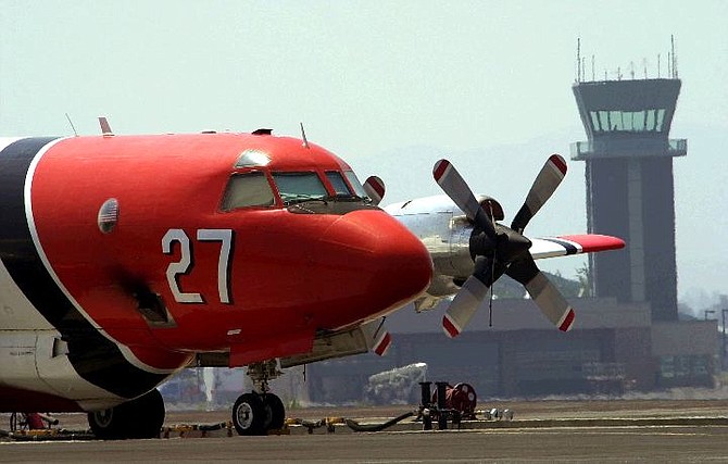 ** FILE ** A P3A air tanker owned by Aero Union sits grounded at Redmond Airport in Redmond, Ore., in this July 19, 2002, file photo, following an air tanker crash in Colorado. Aero Union, the California company that supplied more than a third of the heavy firefighting air tankers grounded by the government said Monday May 17, 2004, it is unfairly being lumped in with a Wyoming firm responsible for most of the catastrophic accidents. (AP Photo/Don Ryan, File)