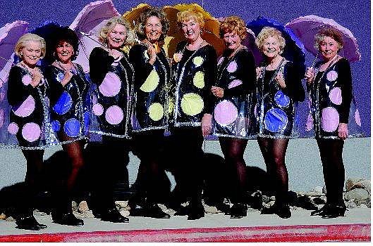Rick Gunn/Nevada Appeal The Golden Girls dance team, from left, Gladys Langson Veitch, Ginny Delaski, Jean Gravenhorst, June McIntyre, Pat Johnson, Barbara MacGee, LaVerne Taylor and Alyce Dickson are in costume for their &#039;Singing in the Rain&#039; number they will perform at the &#039;Senior Follies - A Song for All Seasons&#039; this weekend at the Carson City Community Center.