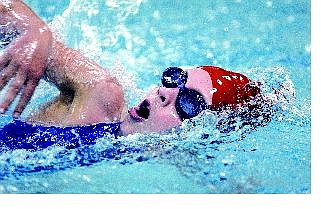 Brea Cook, 8, of the Douglas Dolfins competes in the girls 10 and under 100 freestyle during the final day of the Intermountain Classic at the Carson Aquatic Center on Monday afternoon.
