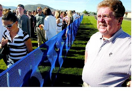 BRAD HORN/Nevada Appeal Paul Scott watches as Carson High School seniors leaves the football field Friday morning after graduation rehearsal Friday morning. Scott will be receiving his diploma during Saturday&#039;s ceremony.