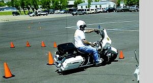 Carson City sheriff&#039;s motorcycle officers Sgt. Mike Cullen, left, and Deputy Bill Richards practice for the upcoming Fun Run on Friday and Police Motor Competition on Saturday at Mills Park. Deputy Wayne Wheeler, rear, is also competing.