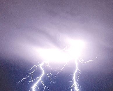 Nevada Appeal file photo Lightning strikes east of Silver Springs during a thunderstorm in this photo taken in 2002.