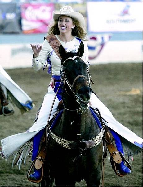 Belinda Grant/Nevada Appeal Tanya Heinrich waves to the Reno Rodeo spectators.
