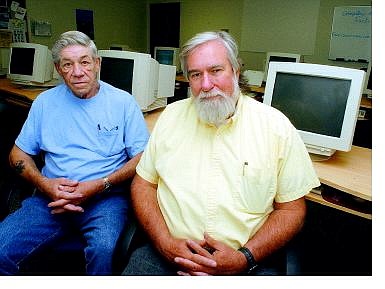 Seth Meyer/Nevada Appeal Volunteers Jerry Shafer, left, and Robert Lukacs work in the Computer Learning Center at the Nevada Rural Housing Authority. They were recently honored with the June 2004 Jefferson Award for their dedication to the center.