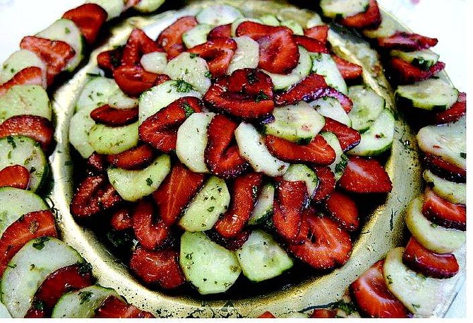 Strawberry cucumber salad made by Molly Gingell is prepared with fresh mint, raspberry vinegar, powdered sugar, strawberries and cucumbers.