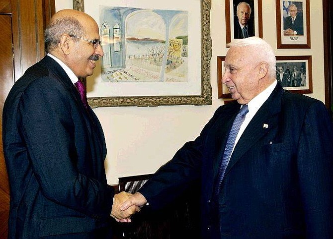 Israeli Prime Minister Ariel Sharon, right, greets Director General of the International Atomic Energy Agency (IAEA), Mohamed ElBaradei at Sharon&#039;s office in Jerusalem Thursday July 8, 2004. Israeli Prime Minister Ariel Sharon is ready to discuss a  nuclear weapons-free zone in the Middle East as part of future peace talks, ElBaradei said after the meeting Thursday. (AP Photo/Avi Ohayon/Government Press Office)  ** ISRAEL OUT NO SALES **