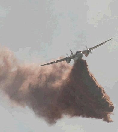 An airtanker drops its load of fire retardant on a wildfire near Floriston on Friday.  Photo courtesy Cheryl Hogan