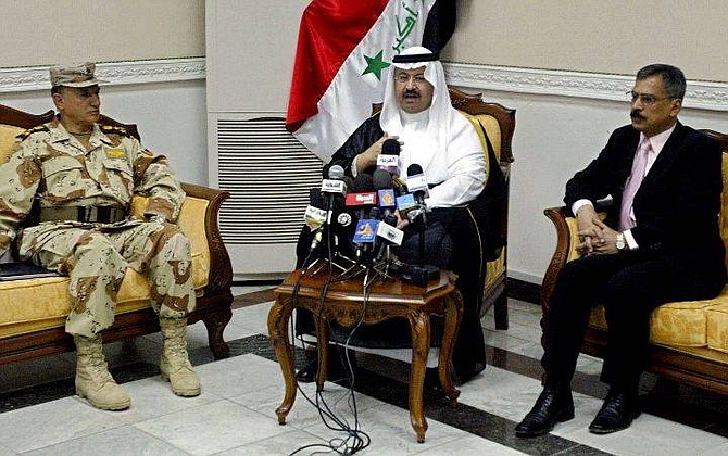 Moder al-Mawla al-Rachidi, commander of the Iraqi National Guard, left, Iraqi President Ghazi al-Yawar, center, and Defense Minister Sheikh Hazen al-Shalan, right, speak at a press conference in Baghdad, Iraq Monday, July 12, 2004. Al-Yawer said his government will soon offer an amnesty to those who have fought against the U.S.-led coalition, a British newspaper reported Monday.(AP Photo/Karim Sahib/Pool)