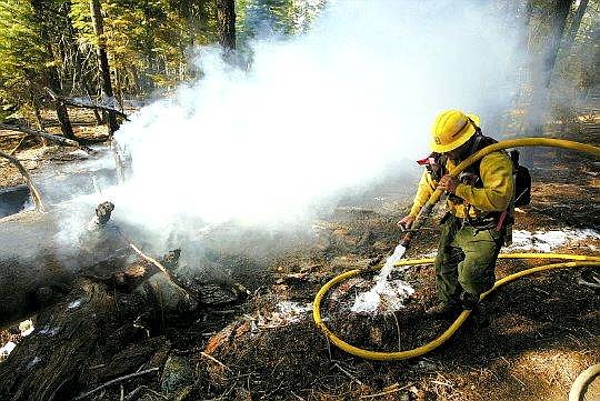 Dan Thrift/Tahoe Daily Tribune Fire fighting personell from South lake Tahoe, Fallen Leaf Lake, Lake Valley and the U.S. Forest Service responed to an approximately 50 by 50 foot fire near Camp Shelly Concord on Tuesday afternoon.