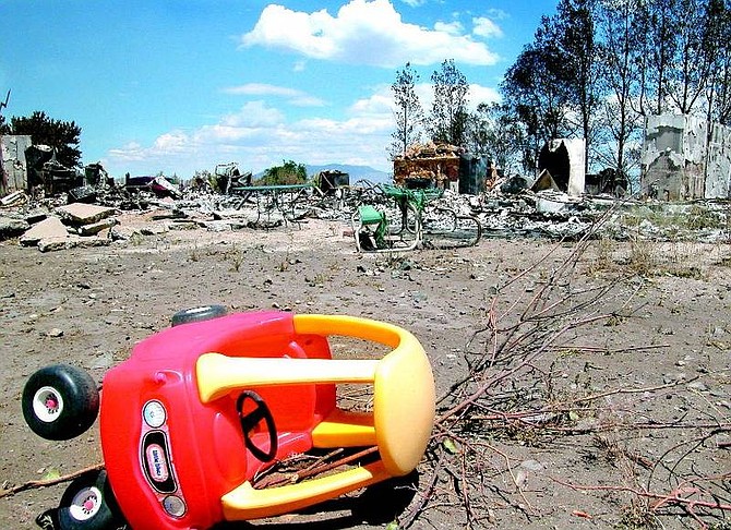 Seth Meyer/Nevada Appeal  A plastic toy car that somehow avoided the blazing heat is a reminder of the fickle nature of a wildfire at  the Darney home in Kings Canyon Sunday.