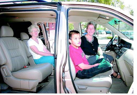 Seth Meyer/Nevada Appeal Eagle Valley Children&#039;s Home Executive Director Pam Smith, in the driver&#039;s seat, sits with one of the home&#039;s clients and Mallory Foundation board member Ellen Shock in the home&#039;s 2004 Honda Odyssey EXL, which was purchased after a donation from the foundation.