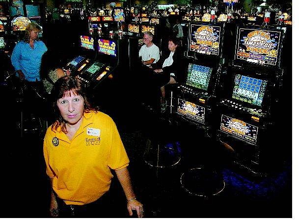 Comstock Casino employee Cathleen Shobert stands in the main gaming room of the new casino on Goni Road.